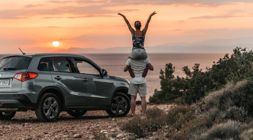 A couple enjoys the scenery with their SUV 