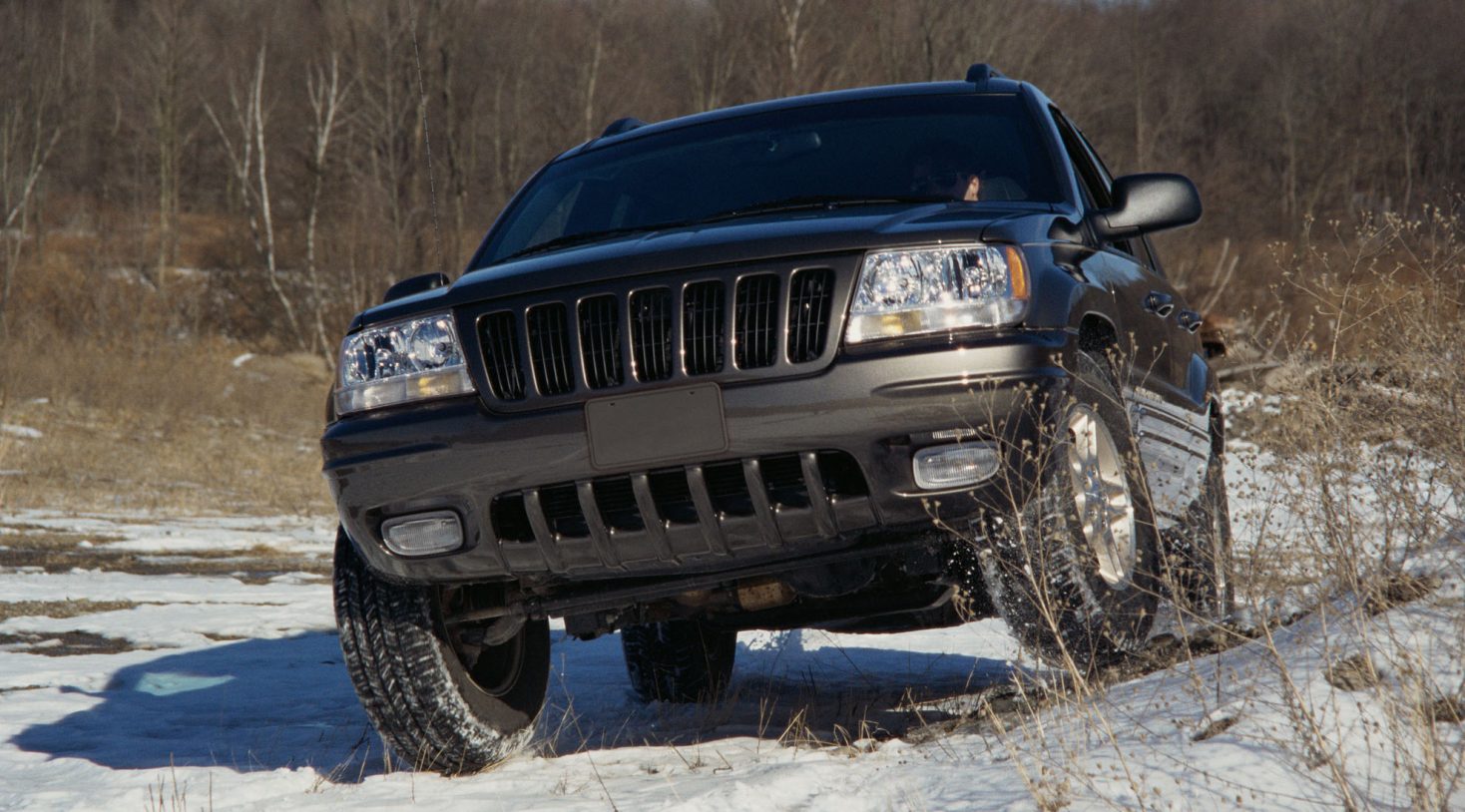 5 Best All-Wheel Drive SUVs Under $30,000 1 Person driving SUV off road in snow