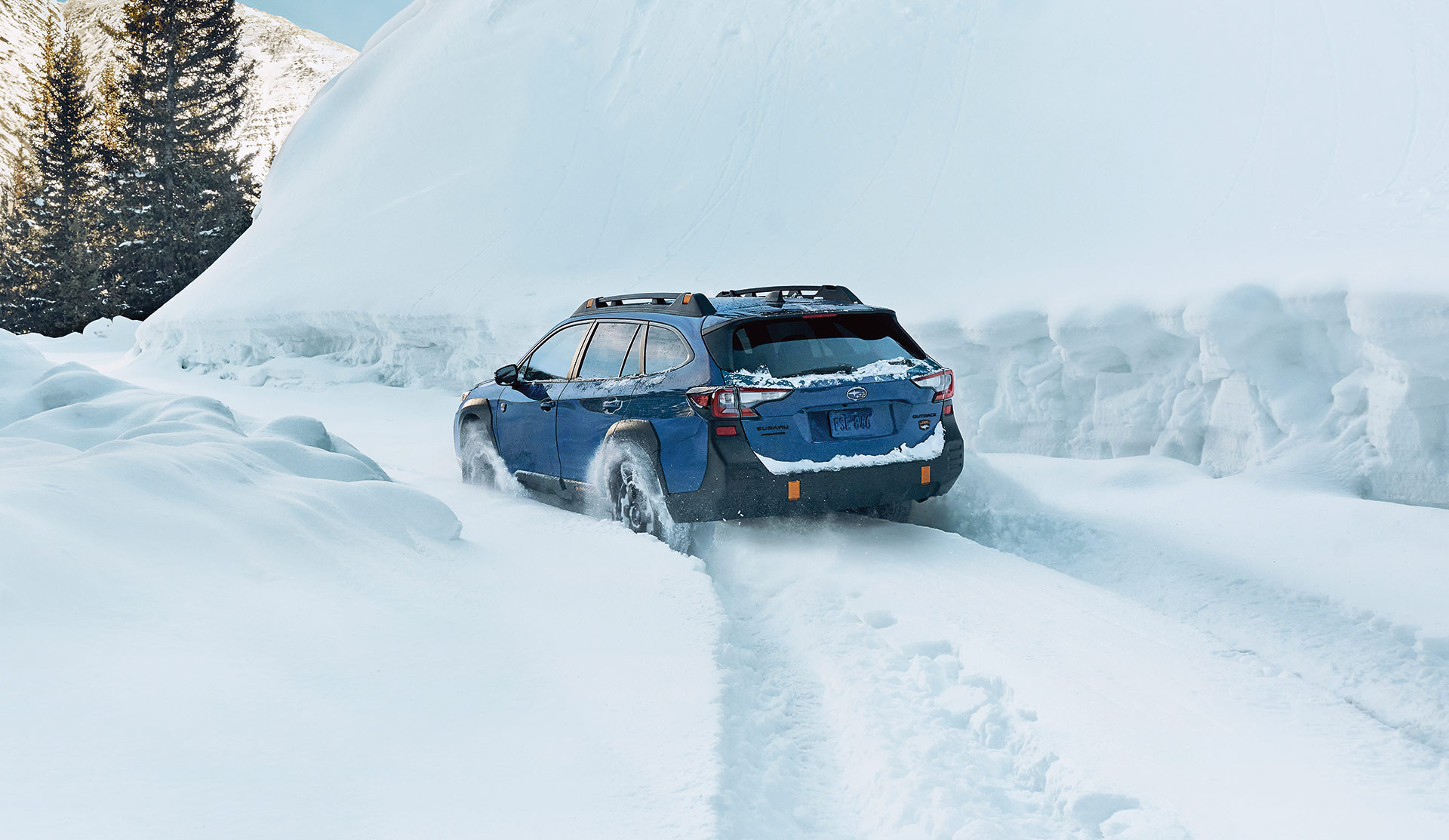 2023 Outback suv driving in snow