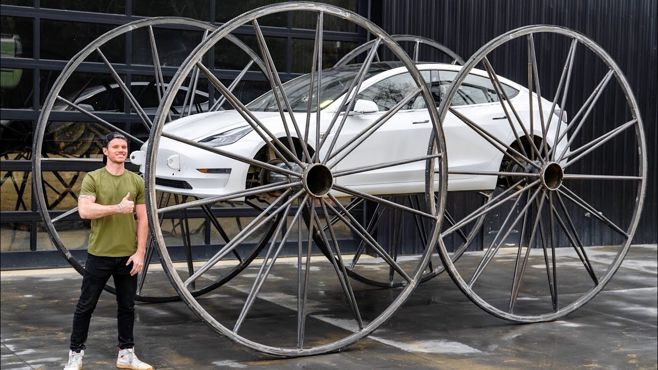 Guy Puts 10 Foot Wheels on Tesla Model 3 Sedan🤣